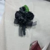 Zwart corsage bruidegom